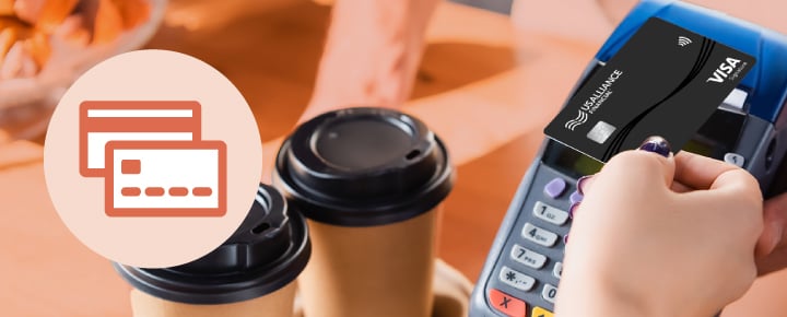 Customer paying for coffee with USALLIANCE credit card