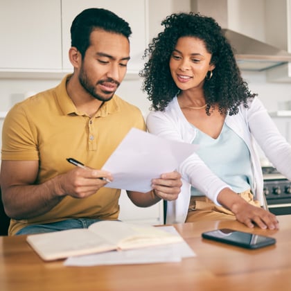 Couple reviewing finances.