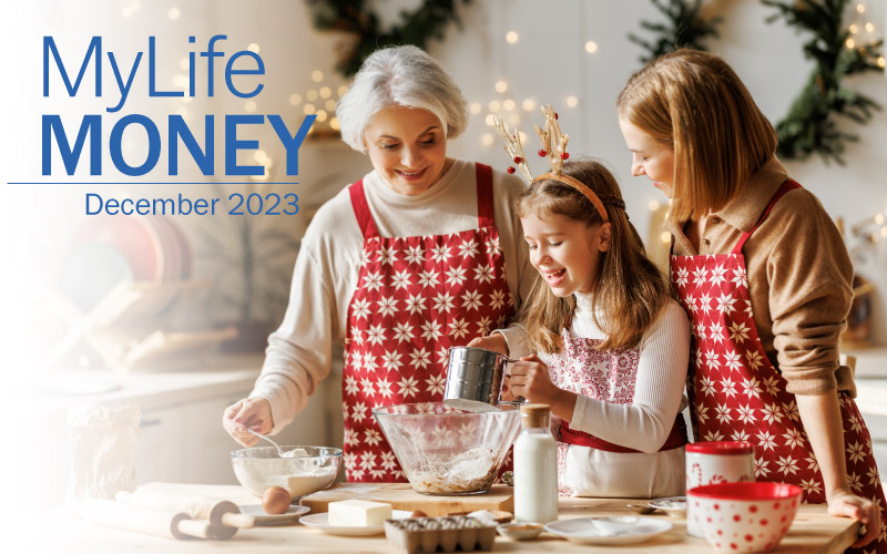 Grandmother teaching daughter and granddaughter how to make holiday treats in the kitchen.