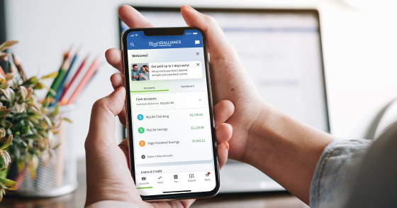 Person using cellphone to access USALLIANCE's upgraded Digital Banking platform
