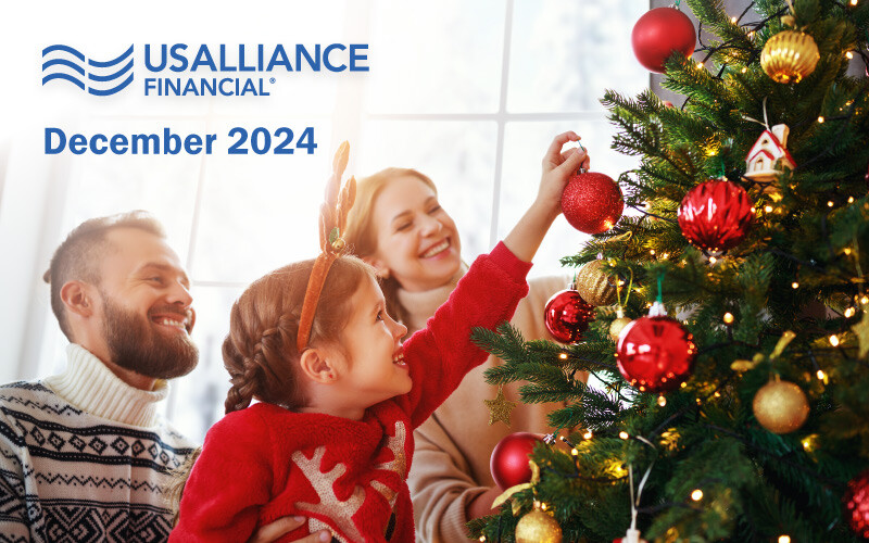 Family decorating a Christmas tree with ornaments