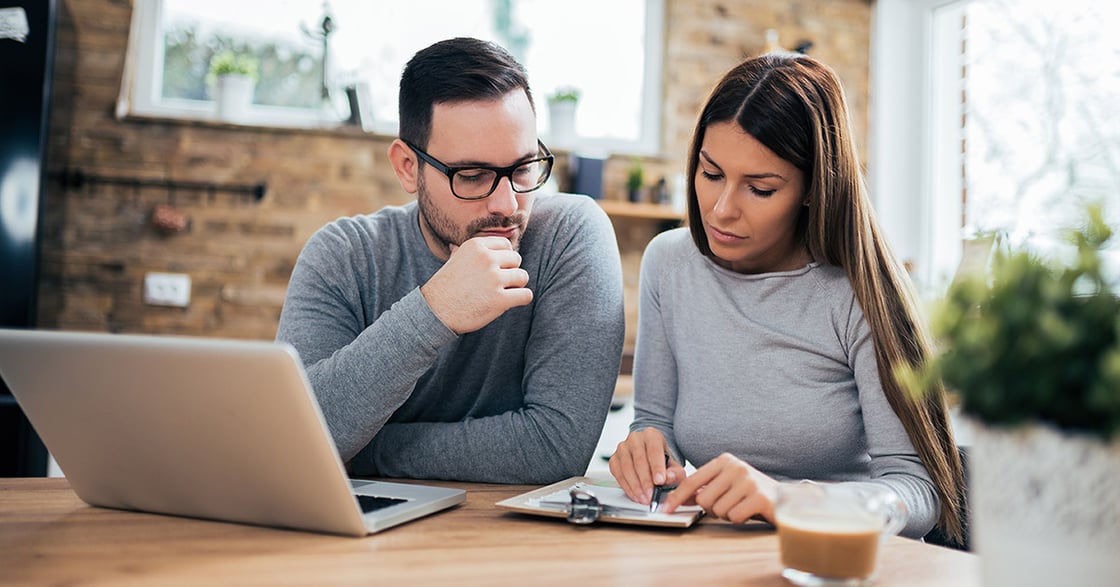 Husband and wife reviewing finances.
