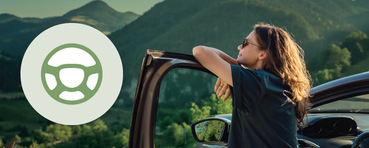 Woman leaning on an open car door, with hills and forests in the background. Steering wheel icon on the left side.