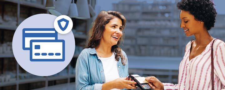A woman in a pottery store paying for her goods with a credit card, and a credit card icon with a shield on it.