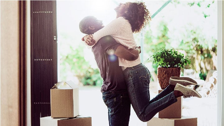 happy man lifting woman