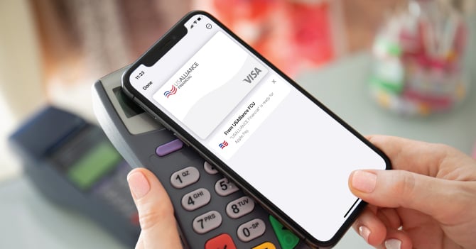 Woman paying for an item at store using digital wallet.