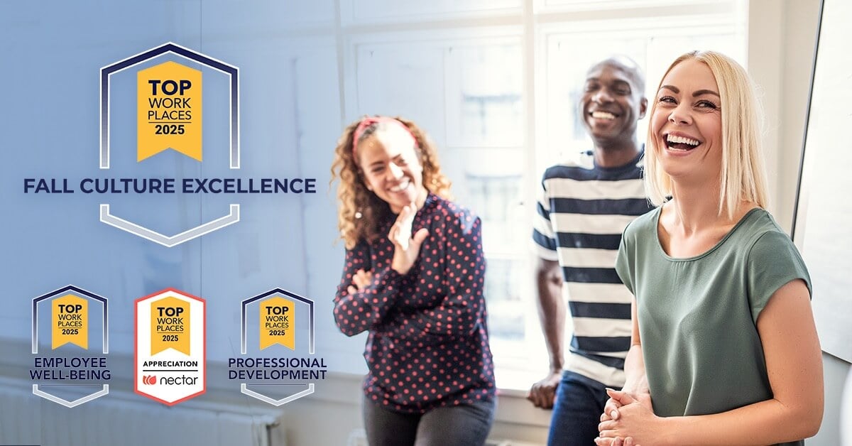 A happy group of employees laughing with the Great place to work award on top.