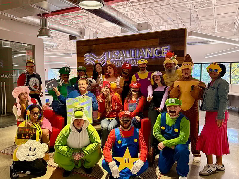 Members of the Marketing, Digital, Financial Assistance, and Loan Servicing departments celebrating Halloween in our Chelmsford Operations Center.